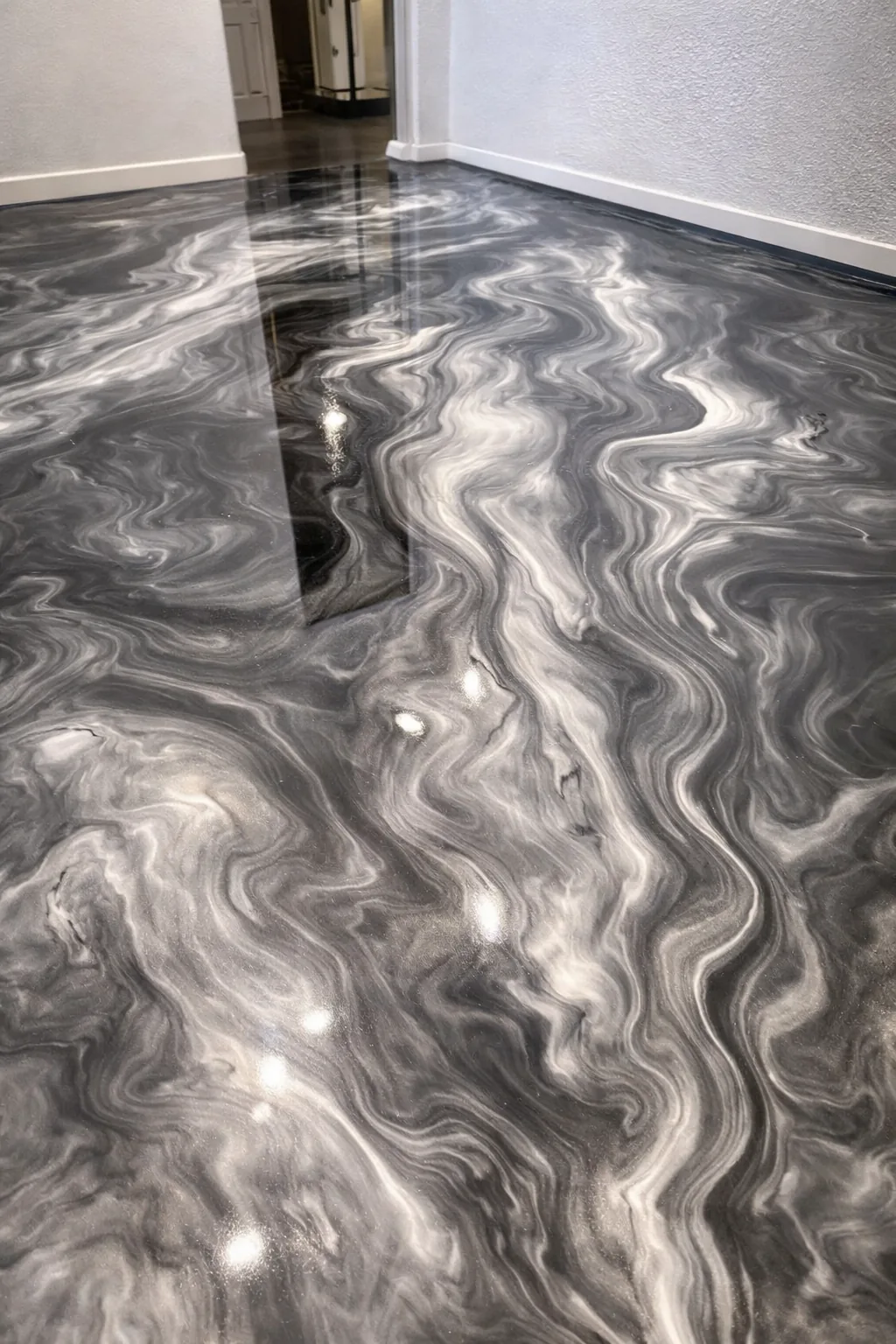Completed epoxy flake garage floor in an Omaha home by PC Premium Coating